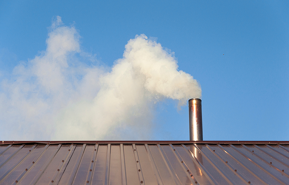 Smoke from wood heater chimney